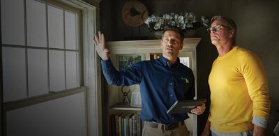 Restoration expert in South Bend talking with customer about restoration services